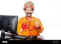 1-indian-rural-gujrati-man-computer-education-and-thumbs-up-showing-FBBEH4