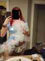 Showing off diaper in blue dress