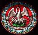 Stained glass depiction of The Pelican in Her Piety from a Catholic church in Saint-Bonnet-la-Rivière, France..jpg