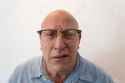 95908879-older-man-bewildered-with-horn-rimmed-glasses-bald-alopecia-chemotherapy-cancer-isolated-on