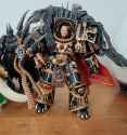 horus Joytoy gold blending in with wood table wh40k