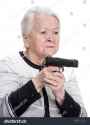 stock-photo-old-woman-with-pistol-on-a-white-background-182174168_jpg