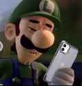 Luigi looking at shitty images on his iphone