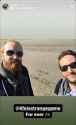 michel and jean luc on the beach smiling