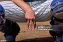 baseball-catcher-signaling-pitcher-his-recommended-pitch