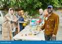 volunteers-helping-homeless-people-food-portrait-group-smiling-camera-arranging-charity-beggars-252894046