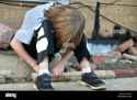 young-boy-defeated-down-and-out-MRJTYW