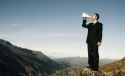 businessman-shouting-top-mountain-50805420-2784974066