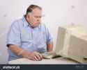 stock-photo-grumpy-old-guy-at-computer-11199934