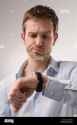 man-looking-at-watch-B3006W