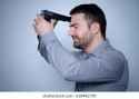 man with gun on head
