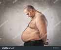 stock-photo-sad-fat-man-looking-at-his-tummy-89698867