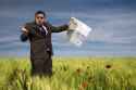 businessman-lost-field-using-map-260nw-26064085