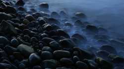 stones-pebbles-seashore-foggy-mist-dark-5k-3840x2160-305