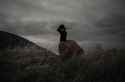 girl-storm-dress-field-clouds