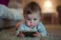 ai-generated-baby-using-smartphone-addiction-to-gadgets-photo (1)