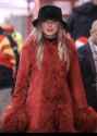 wearing-an-a-on-her-hat-and-a-red-coat-way-to-make-it