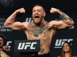 featherweight-champion-conor-mcgregor-poses-on-the-scale-news-photo-592224614-1553598071